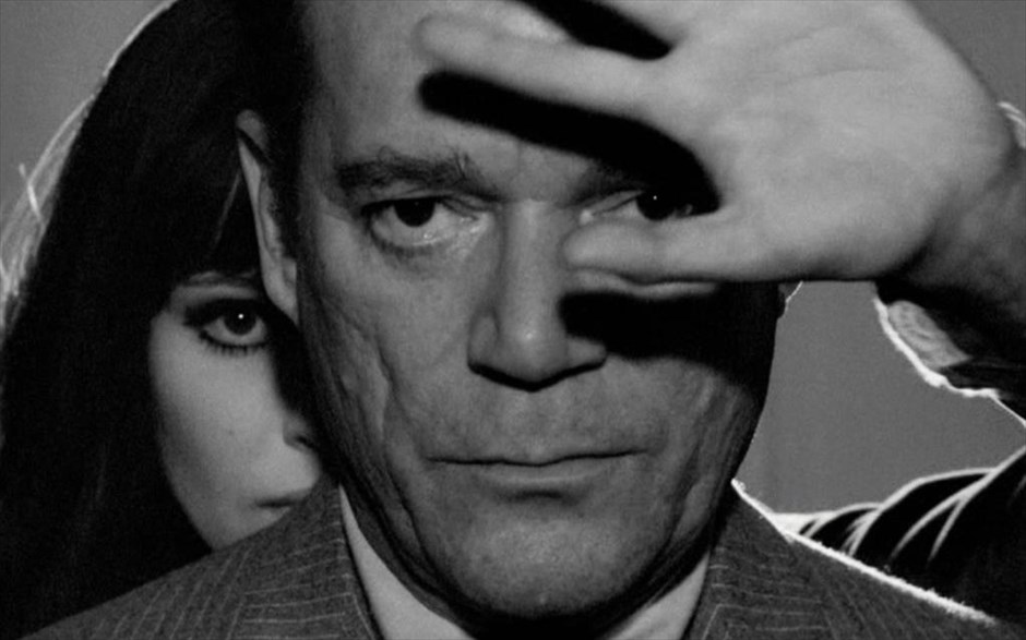 Eddie Constantine y Anna Karina en "Alphaville: une étrange aventure de Lemmy Caution” (1965).Jean-Luc Godard. El Polar francés. estrellamillansanjuan.es